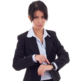 angry business woman pointing her watch